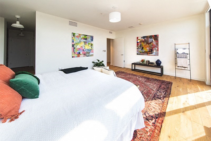 Bedroom with White Walls and Large Carpet at The Assembly, Detroit, MI