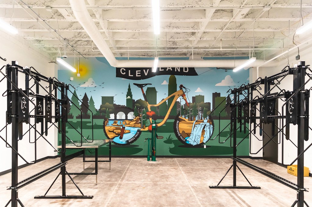 Bike repair room at The May with Cleveland mural in the background.