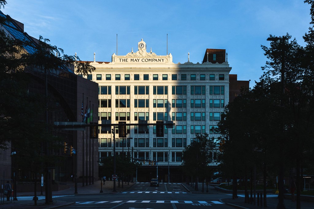Exterior view of The May facade with dramatic lighting.