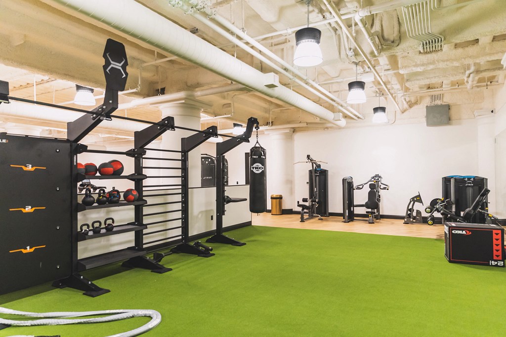 Indoor fitness area at The May, featuring a variety of state of the art gym equipment.