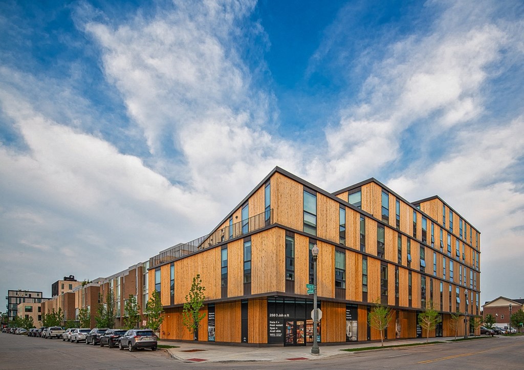 a large brick building on the corner of a city street