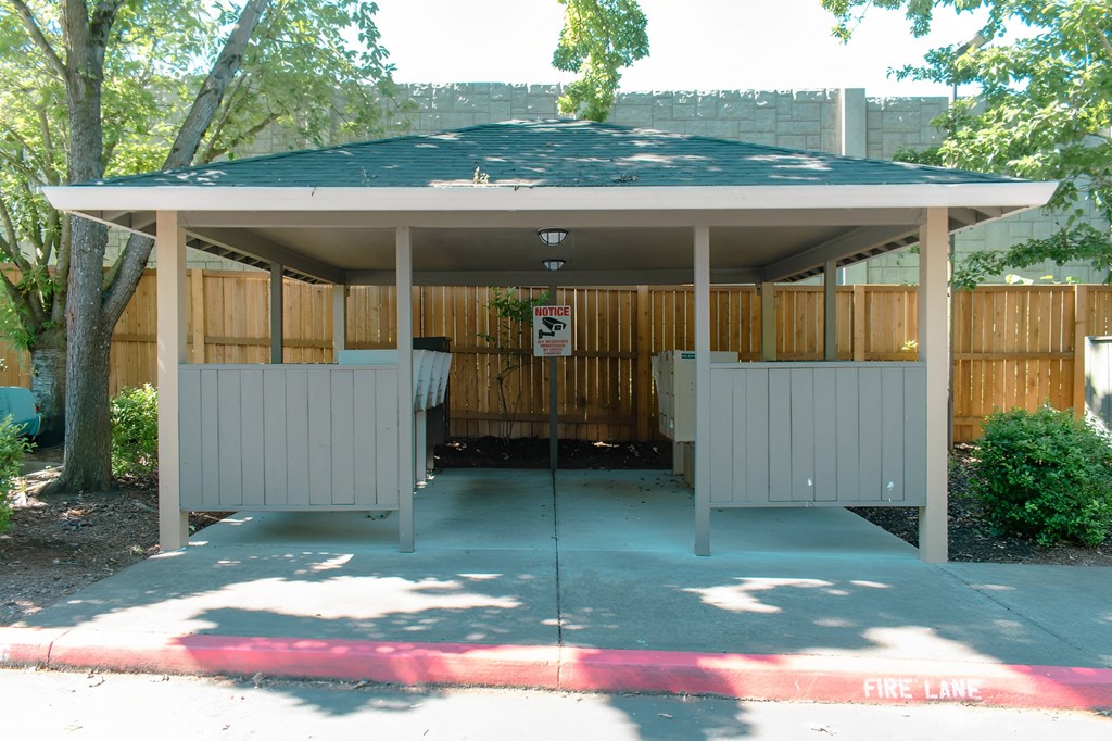 A covered walkway with a fire lane painted in red.