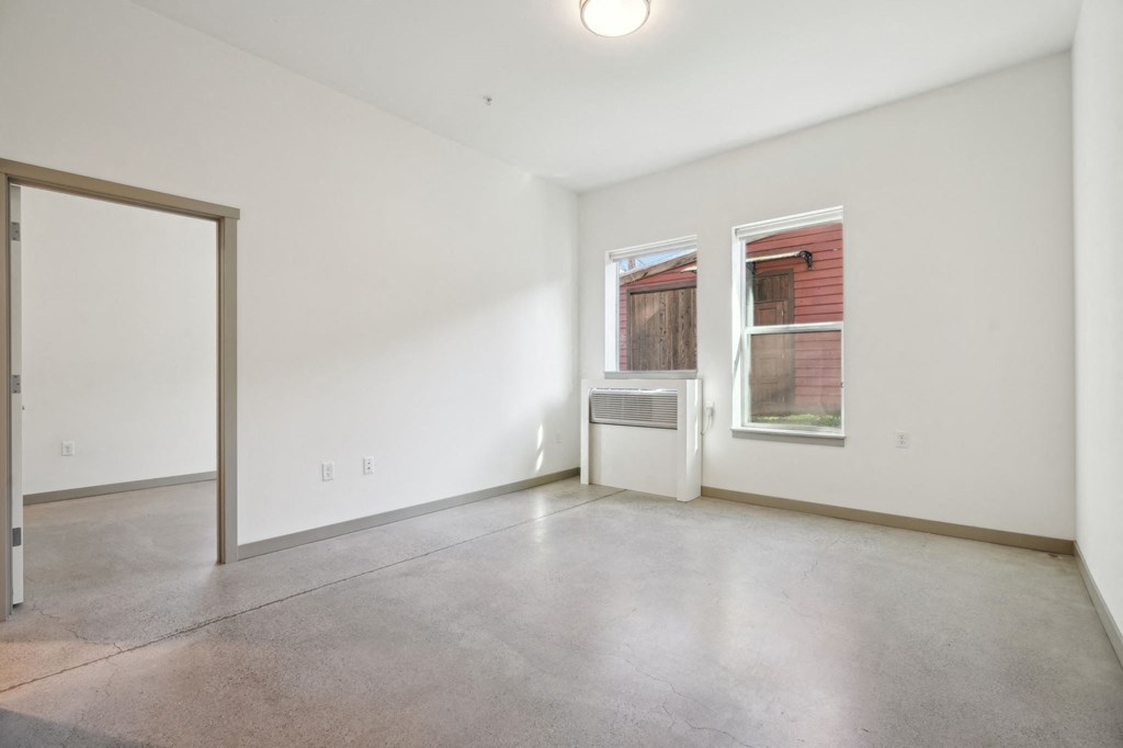 A room with a window and a door.