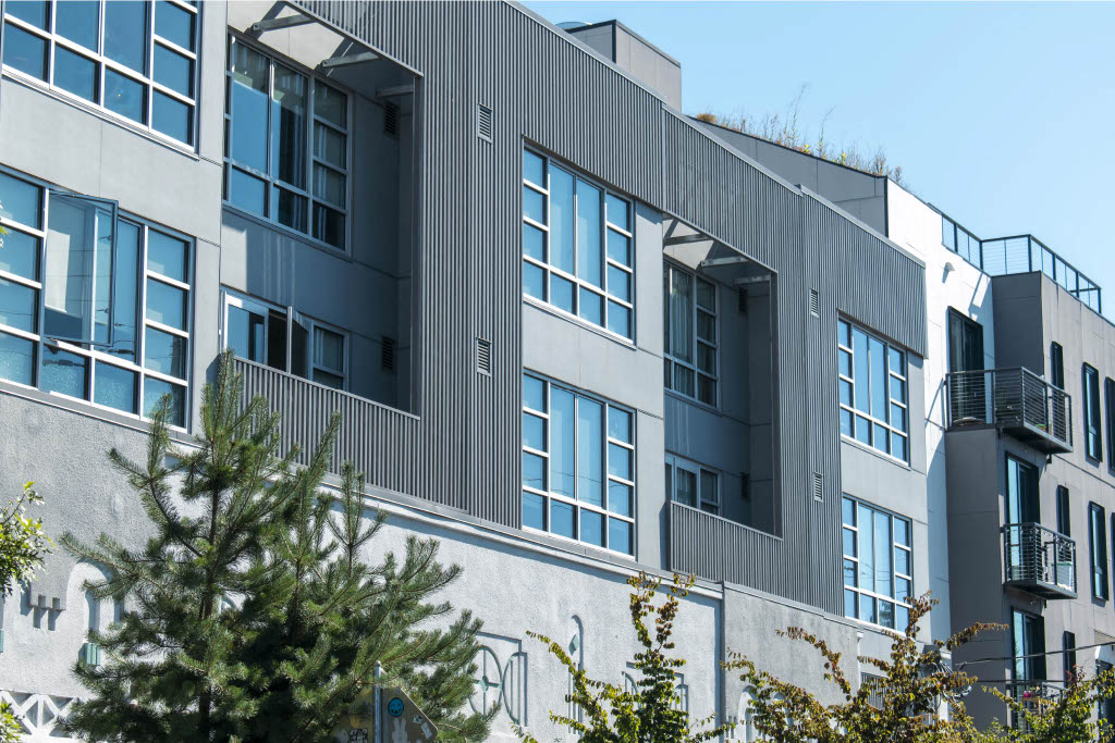 A modern building with a lot of windows and balconies.