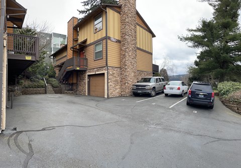 a parking lot in front of a house