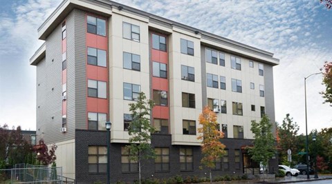 an apartment building on the side of a street