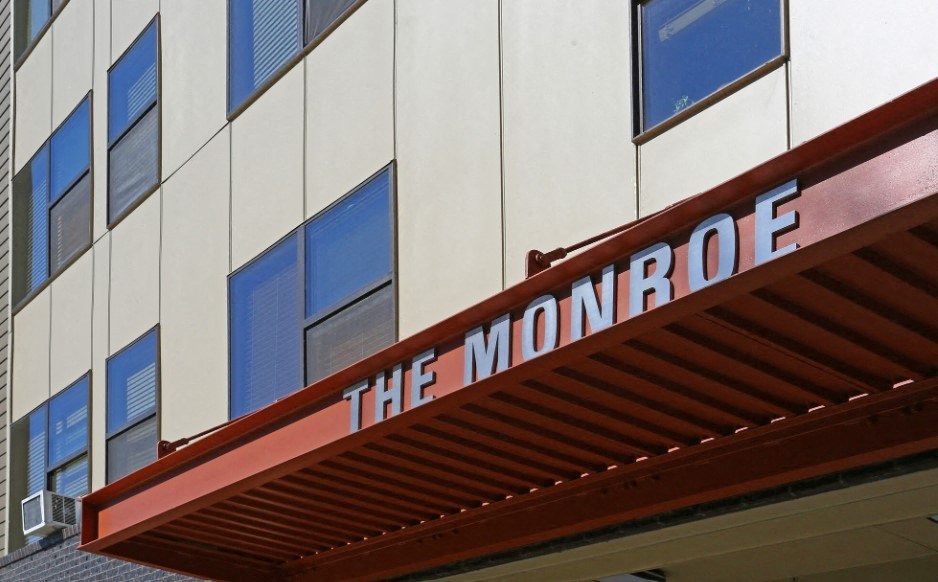 the front of a building sign on it