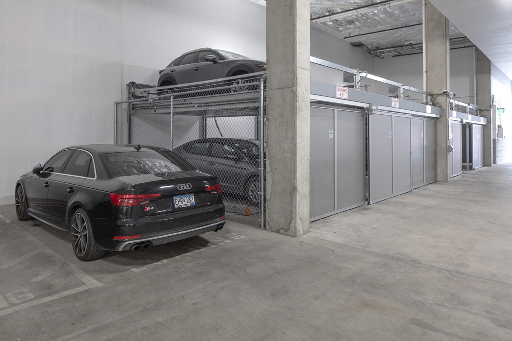 a car parked in a parking garage with a car on top of a rack at The Weidler in Portland, OR 97209