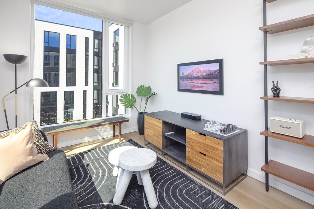 a living room with a couch and a coffee table at The Weidler in Portland, OR 97209