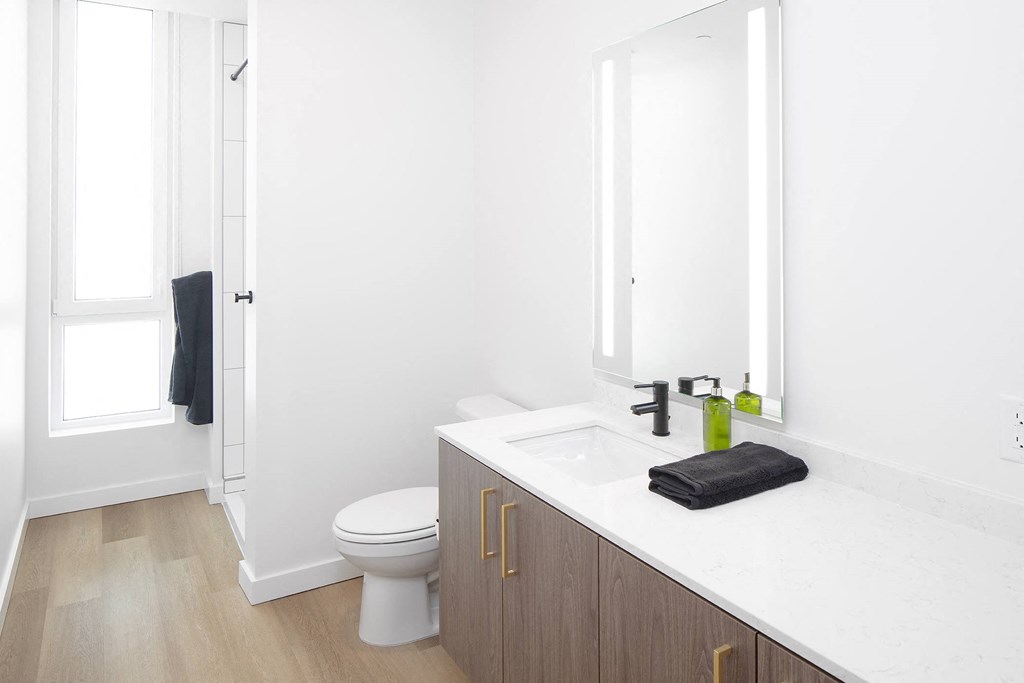 a bathroom with a sink and a toilet at The Weidler in Portland, OR 97209