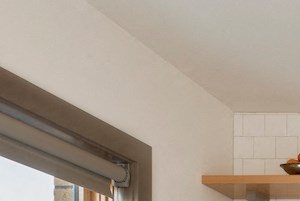 A modern kitchen with a stainless steel refrigerator, oven, and microwave.