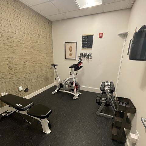 Home fitness room with bike and weights at Northwood, Portland, OR