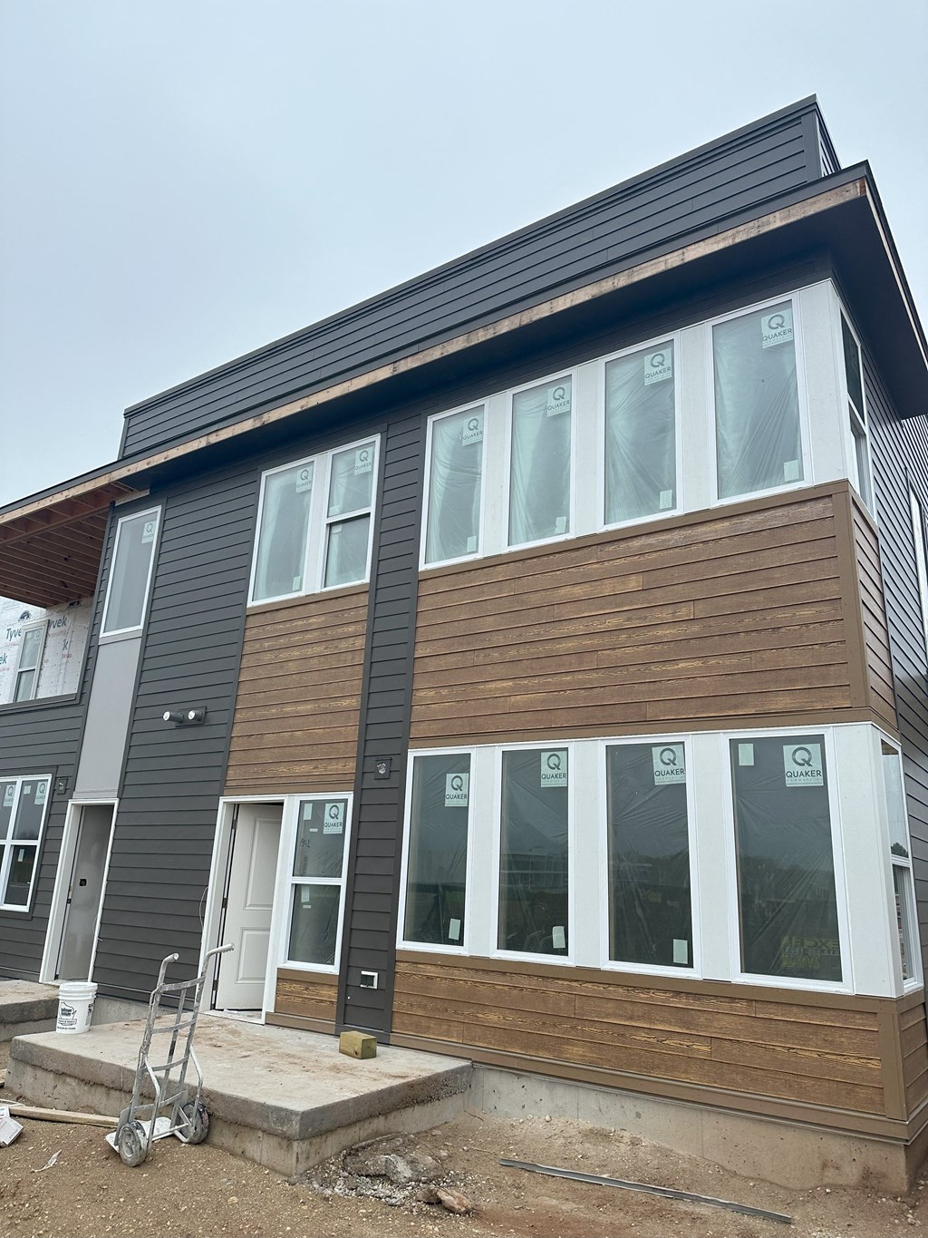 a house with wood siding on the side of it