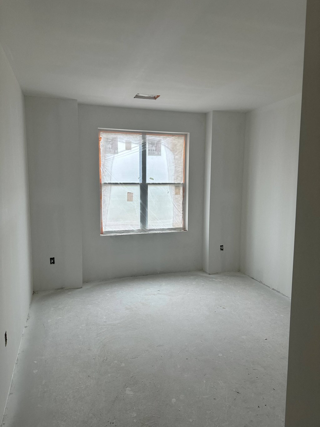 an empty room with a window in it