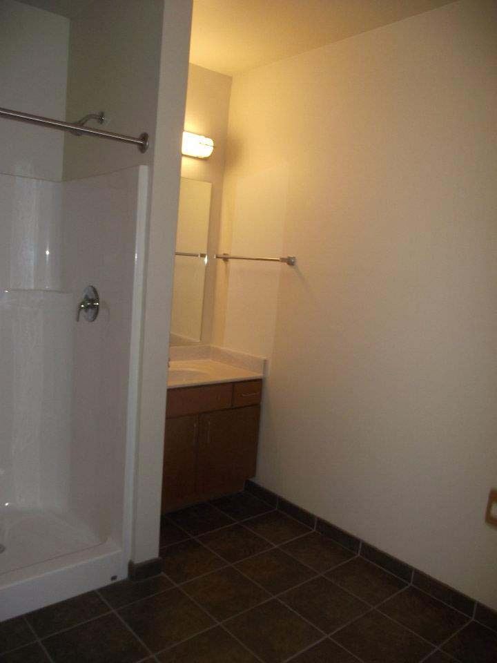 Interior a white bathroom with a shower and a sink