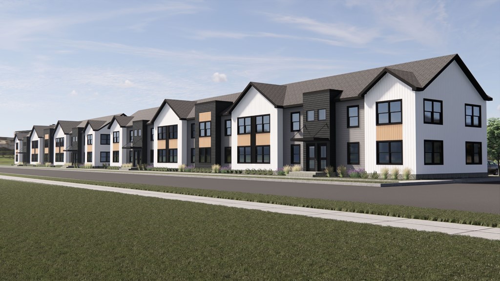 A row of modern houses with white walls and black roofs.