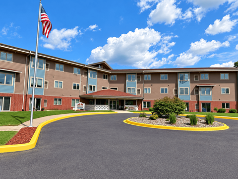 A large building with a flag on top of a pole.