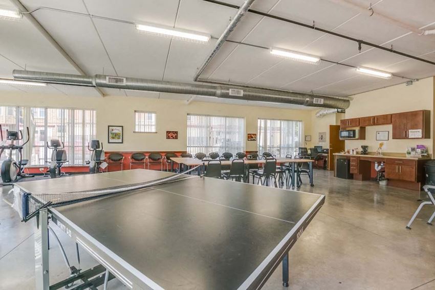 Interior a large room with a ping pong table in the middle