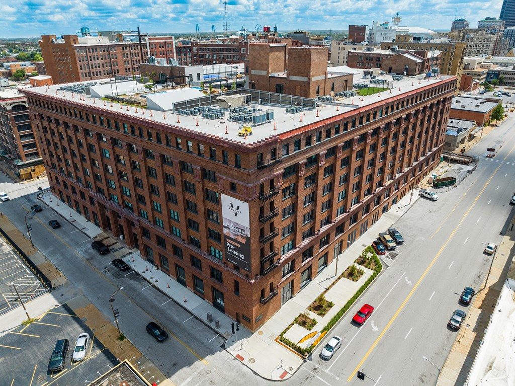 a large brick building with a white roof