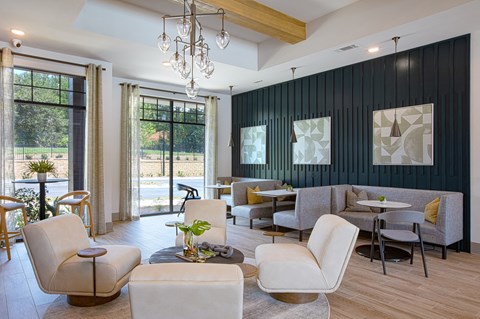 a living room filled with furniture and a chandelier