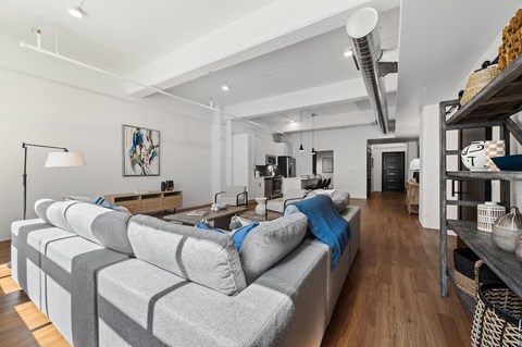 a living room filled with furniture and a large window