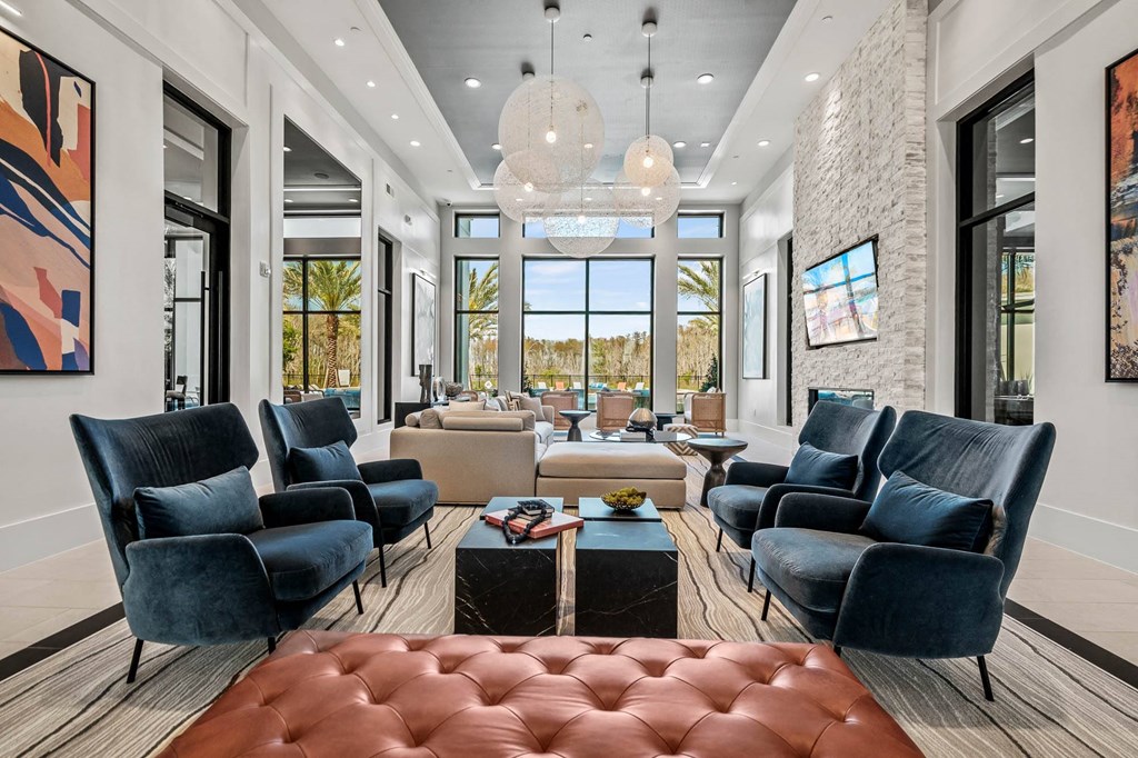 a living room with couches and chairs and a table