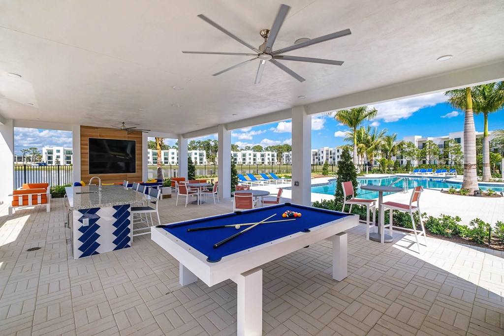 play pool at the retreat at thousand oaks apartments with pool table at Altis Blue Lake, Lake Worth, FL, 33467