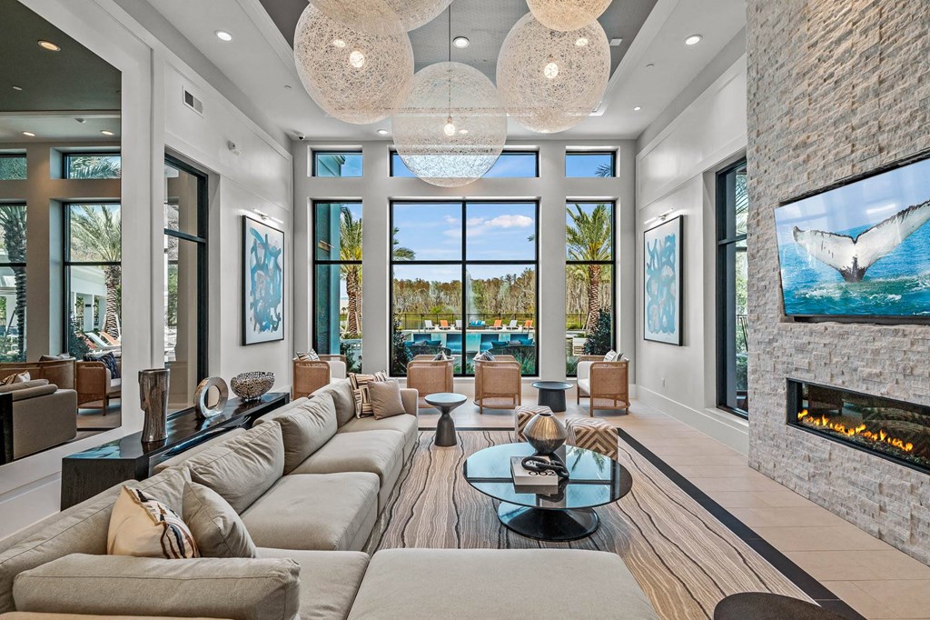 a living room with couches and a view of the ocean  at Altis Grand Suncoast, Land O' Lakes, 34638