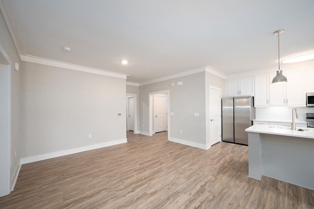 a kitchen and living room in a 555 waverly unit