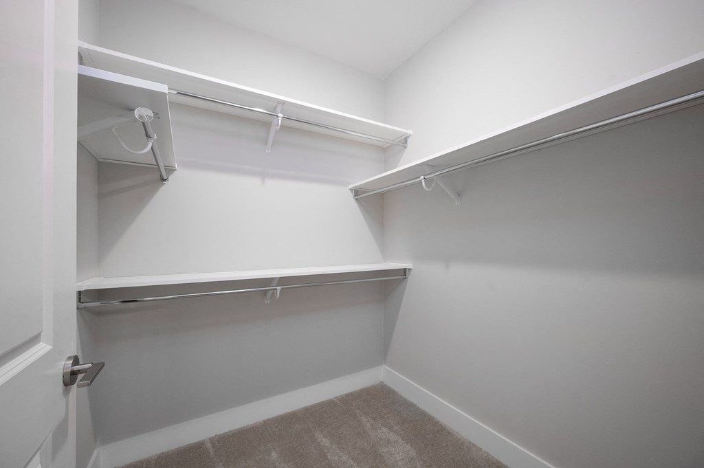 a spacious walk in closet in a 555 waverly unit