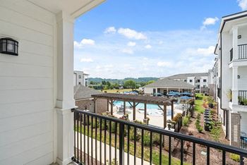 the view of the pool from the balcony at the preserve at polk apartments