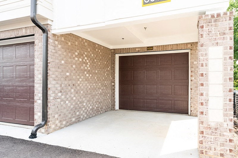 a lobby of a building with two brown doors