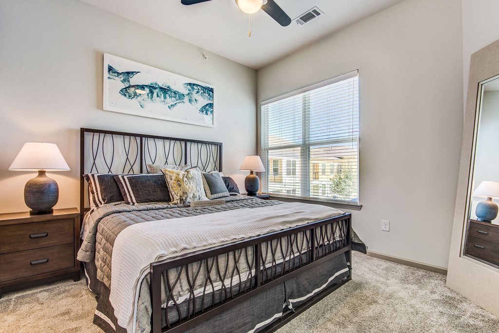 Apartments In Lewisville, TX - Hebron 121 Station - Spacious Bedroom With Premium Carpeting, Ceiling Fan, And Window For Natural Sunlight