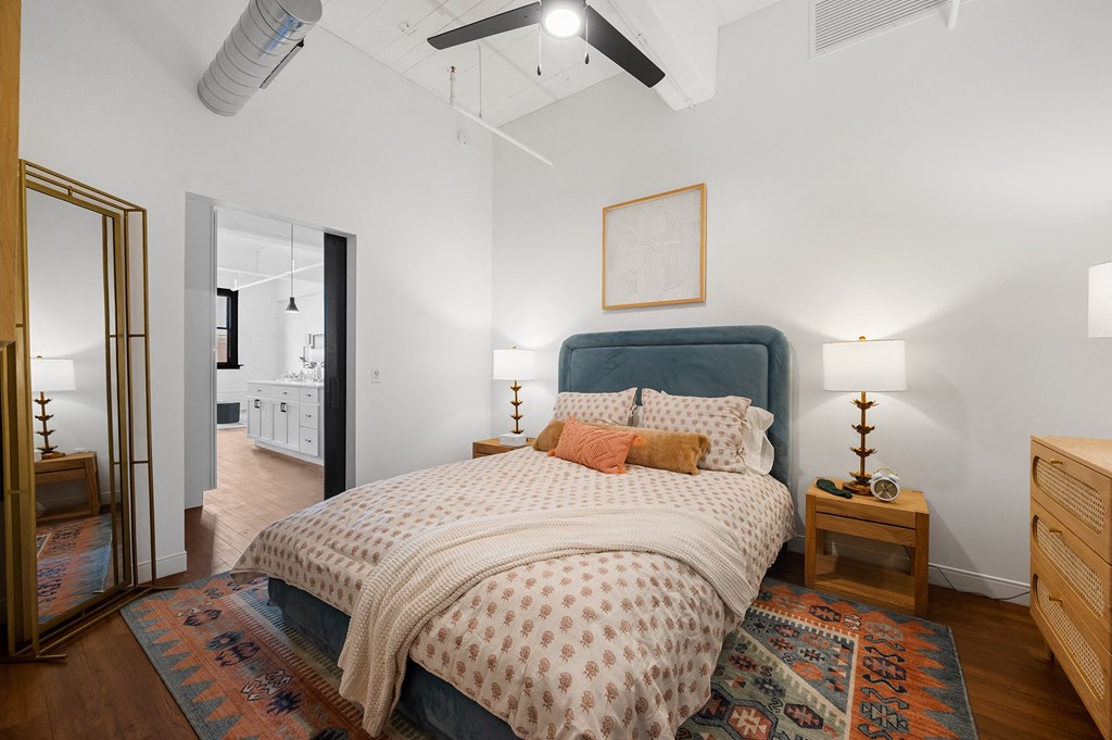 a bedroom with a bed and two night stands