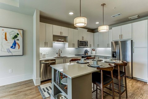 a kitchen with a center island and a counter top