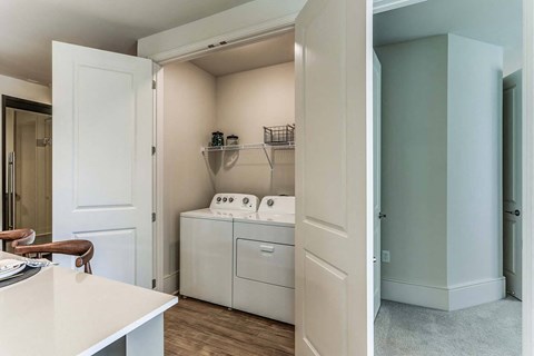 a laundry room with a washer and dryer in it