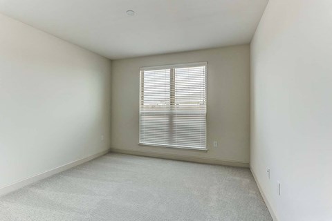 an empty room with a window in it