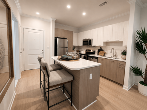 A kitchen with a table and chairs in the middle of the room.