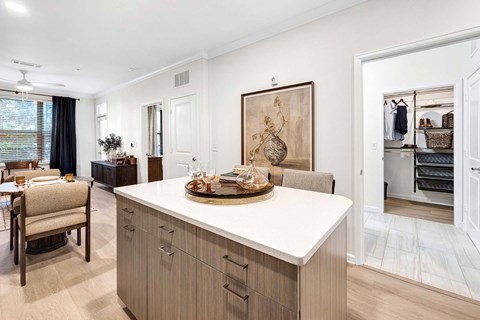 A modern kitchen with a dining table and chairs.