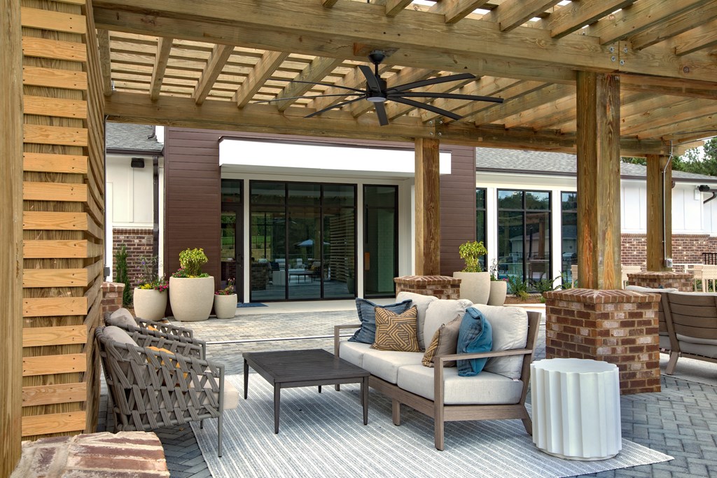 a patio with a wooden pergola