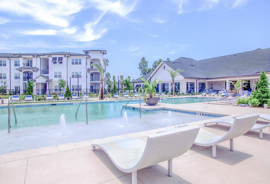 our apartments have a resort style pool and lounge chairs
