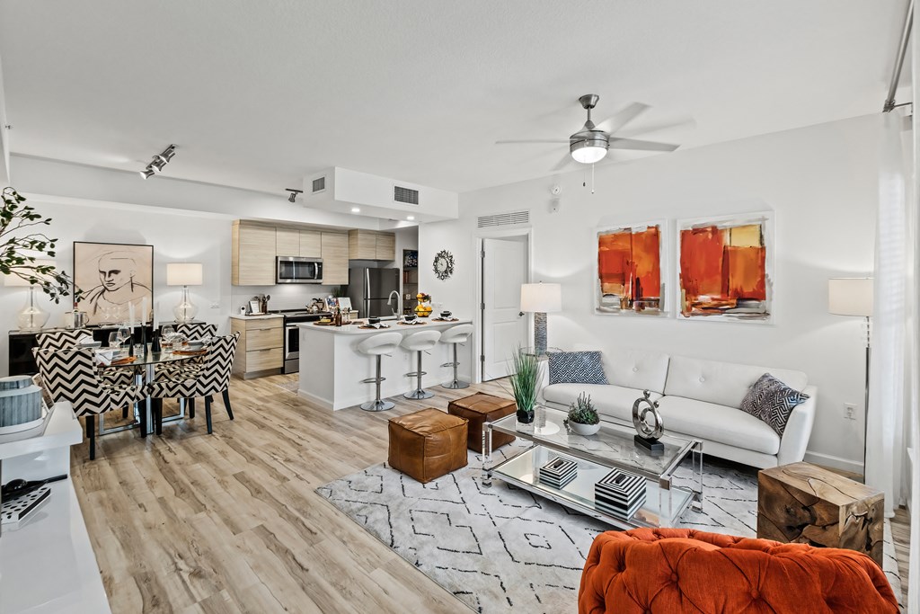 our apartments offer a spacious living room with a kitchenette and dining area at Altis Grand Lake Willis, Orlando Florida