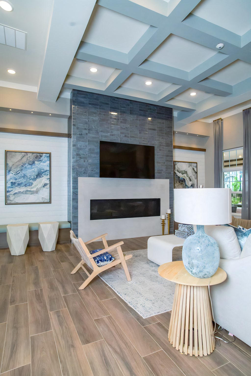 a living room with a white couch and a fireplace