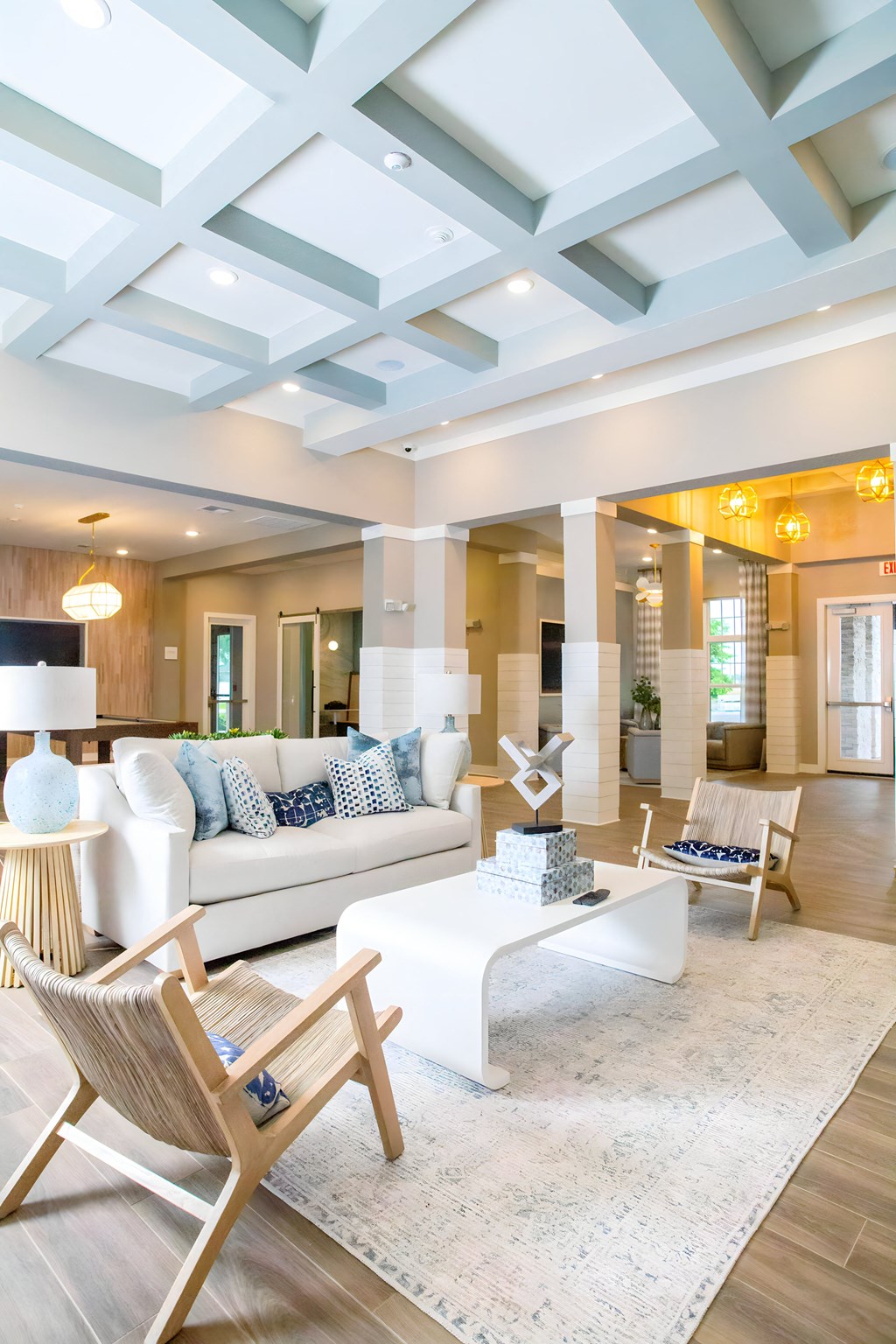 a living room with a white couch and a coffee table