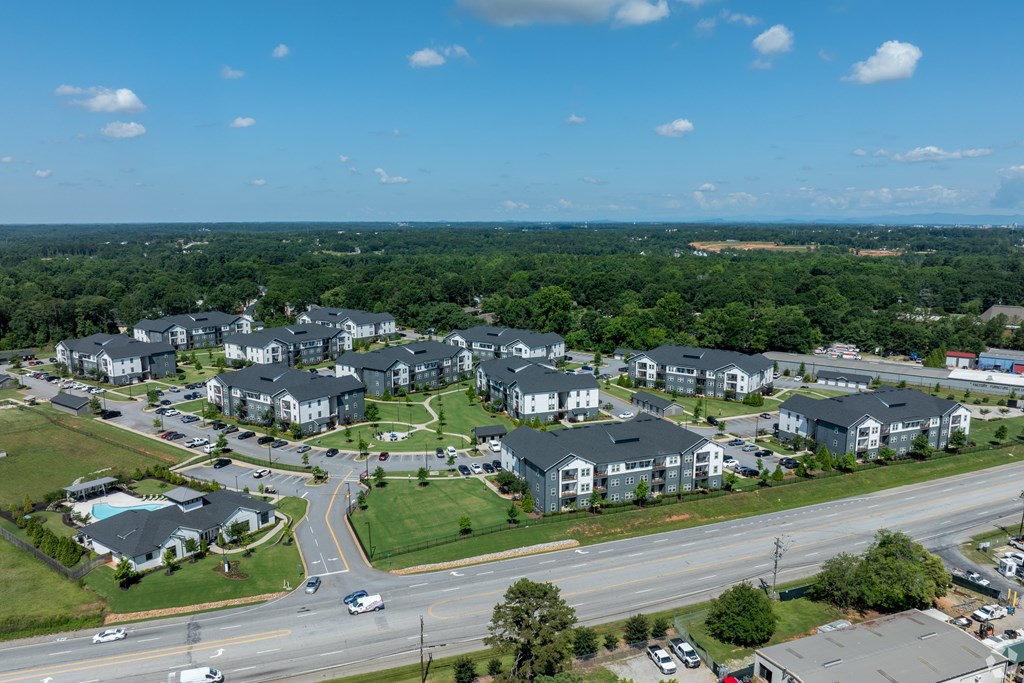 A large residential complex with multiple buildings and a parking lot.