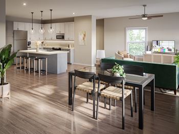 a living room and kitchen with a table and chairs