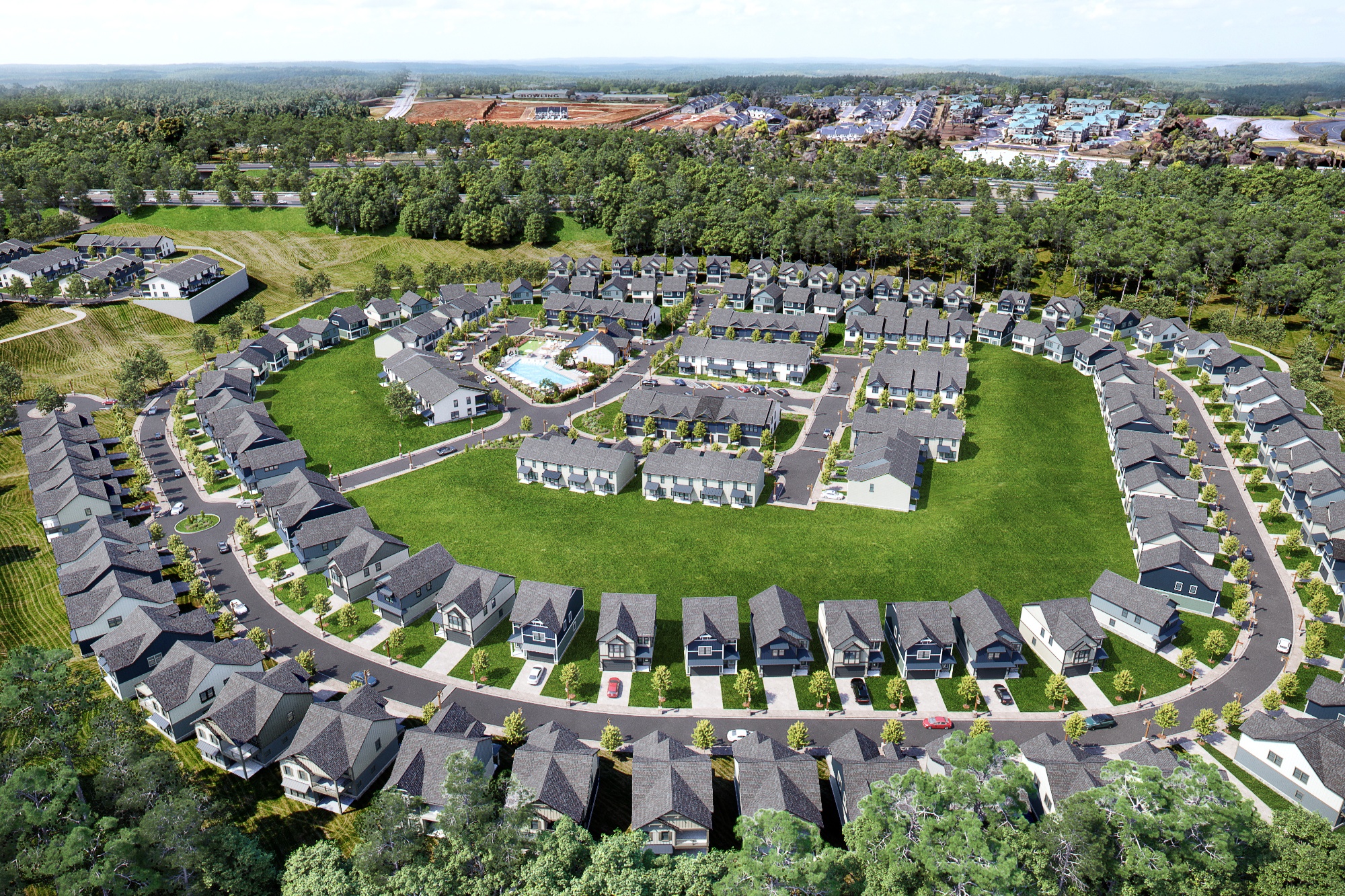 A bird's eye view of a residential area with houses and a green field.