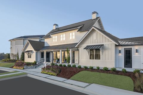 a rendering of a house with a front porch and a front yard