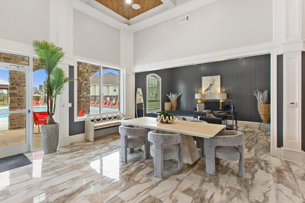 a dining room with a table and chairs