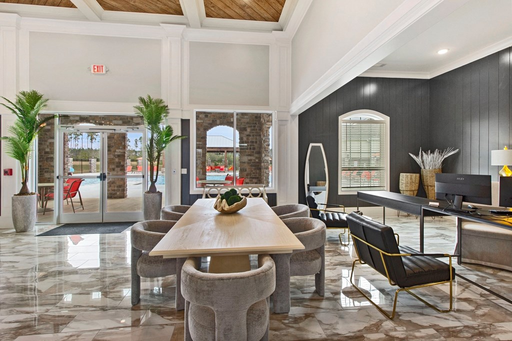 a living room with a table and chairs